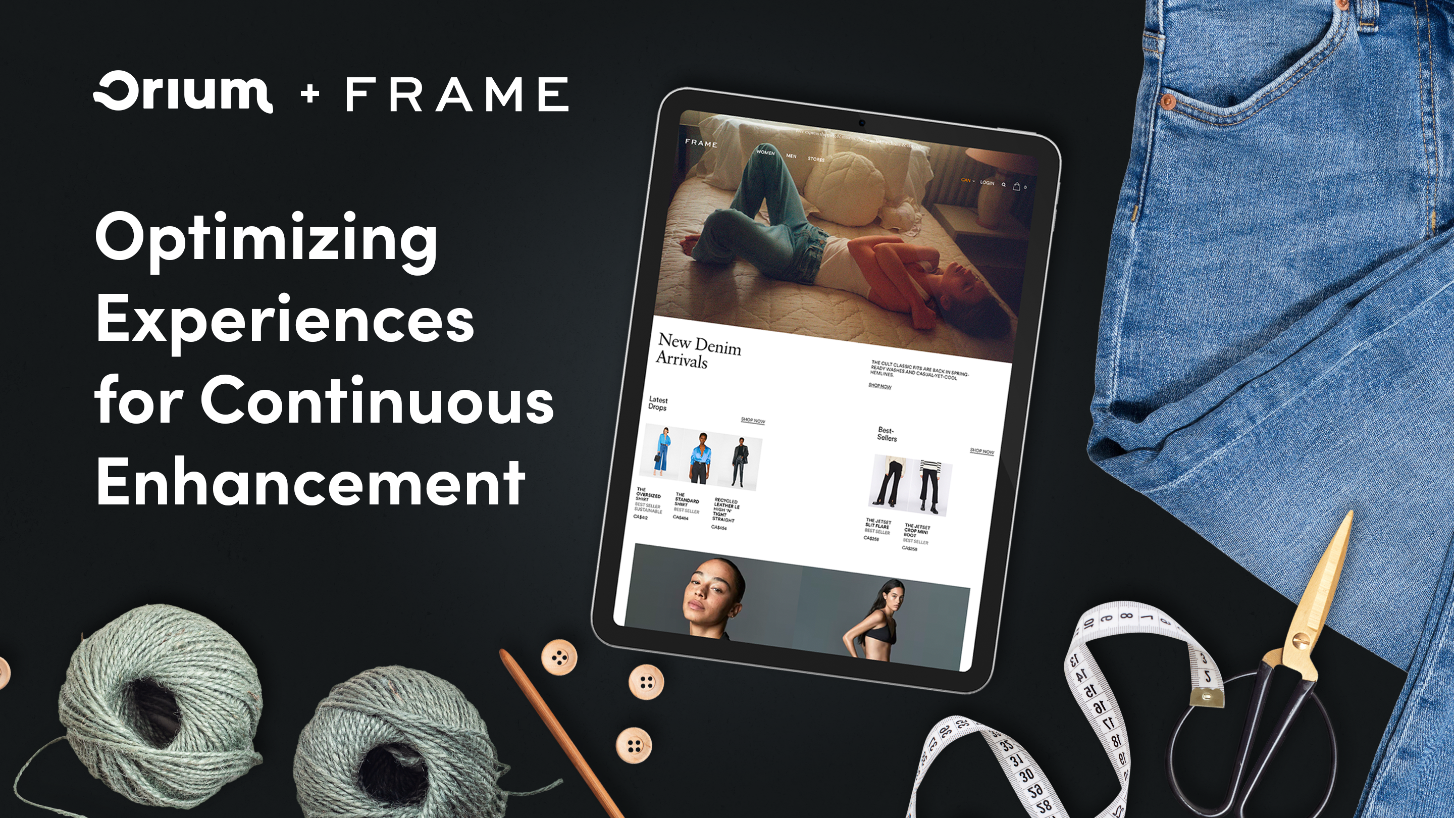 Flatylay of FRAME website on an iPad surrounded by a pair of jeans, threads, buttons, scissors, and a tape measure.